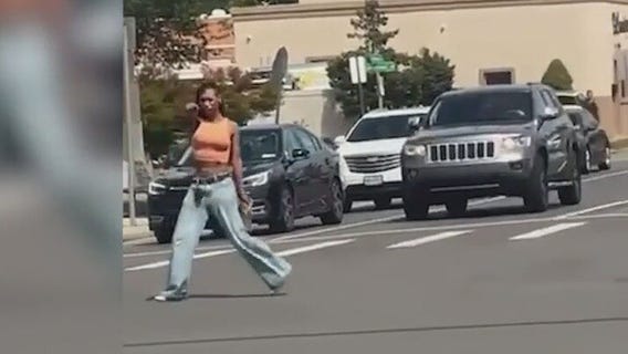 Across America: Video shows woman waving gun in middle of intersection