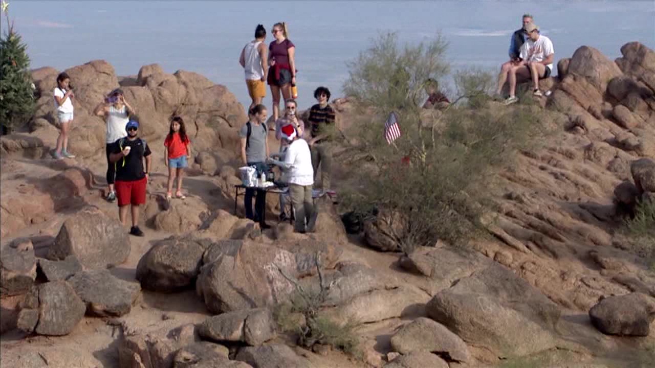 Santa giving out tacos on Camelback Mountain as the holiday approaches
