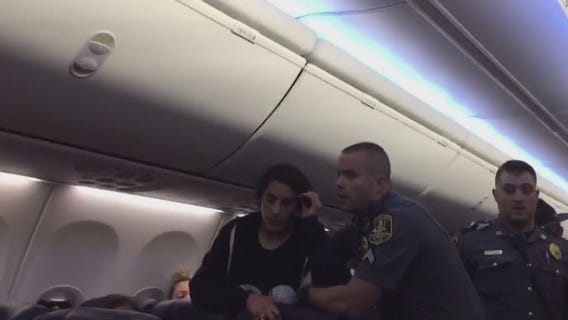 Video shows woman being removed from Southwest flight