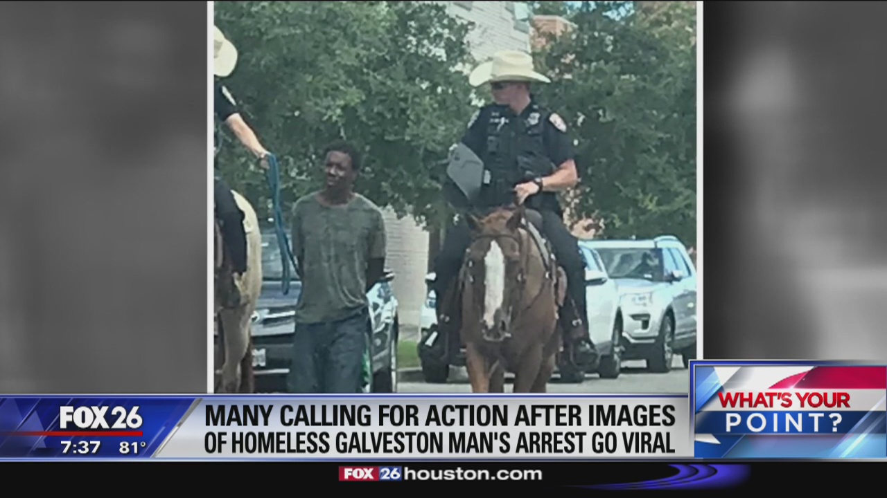 Galveston suspect led down the Strand tied with a rope by mounted officers