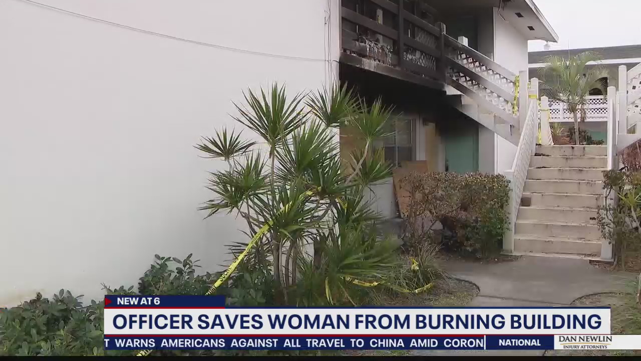Officer saves woman from burning building