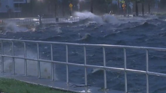 Waves crash over walls at Lake Monroe during Tropical Storm Nicole