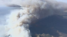 Firefighters attack flare-up of Woolsey Fire near Lake Sherwood