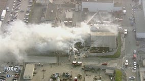 Firefighters extinguish small grass fire outside Fremont Tesla plant
