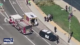 Witnesses say innocent bystander at Lake Merritt  struck by stray bullet resulting from a gun battle between people  2 vehicles