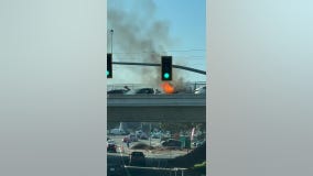 Man tries to save trapped woman, baby in burning car