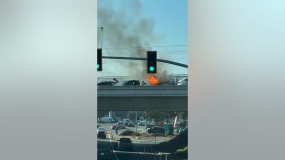 Man tries to save trapped woman, baby in burning car