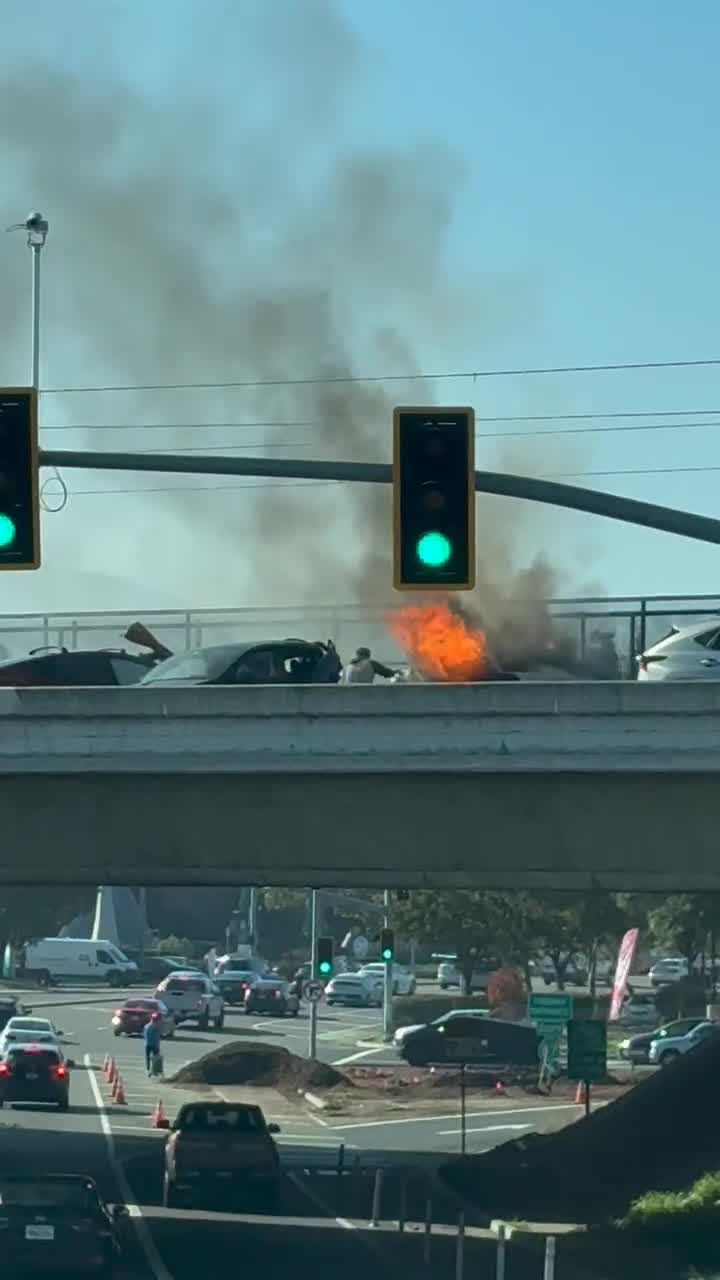 Man tries to save trapped woman, baby in burning car