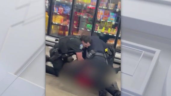 Officer throws punches during grocery store arrest