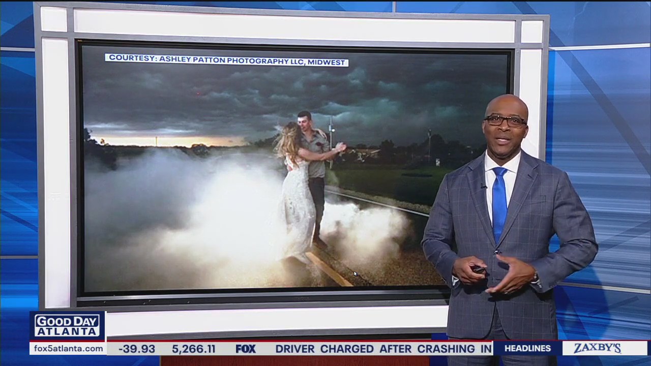 Newlyweds pose in thunderstorm