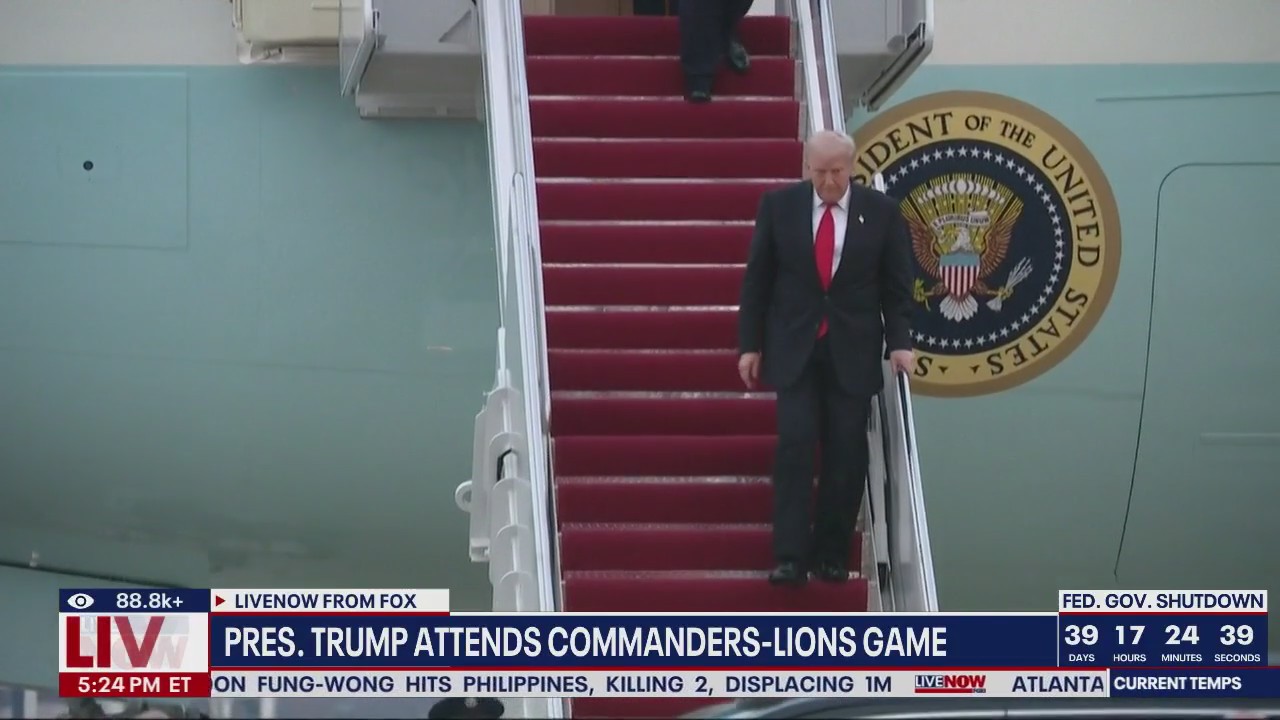 Air Force One flies over the Washington Commanders stadium