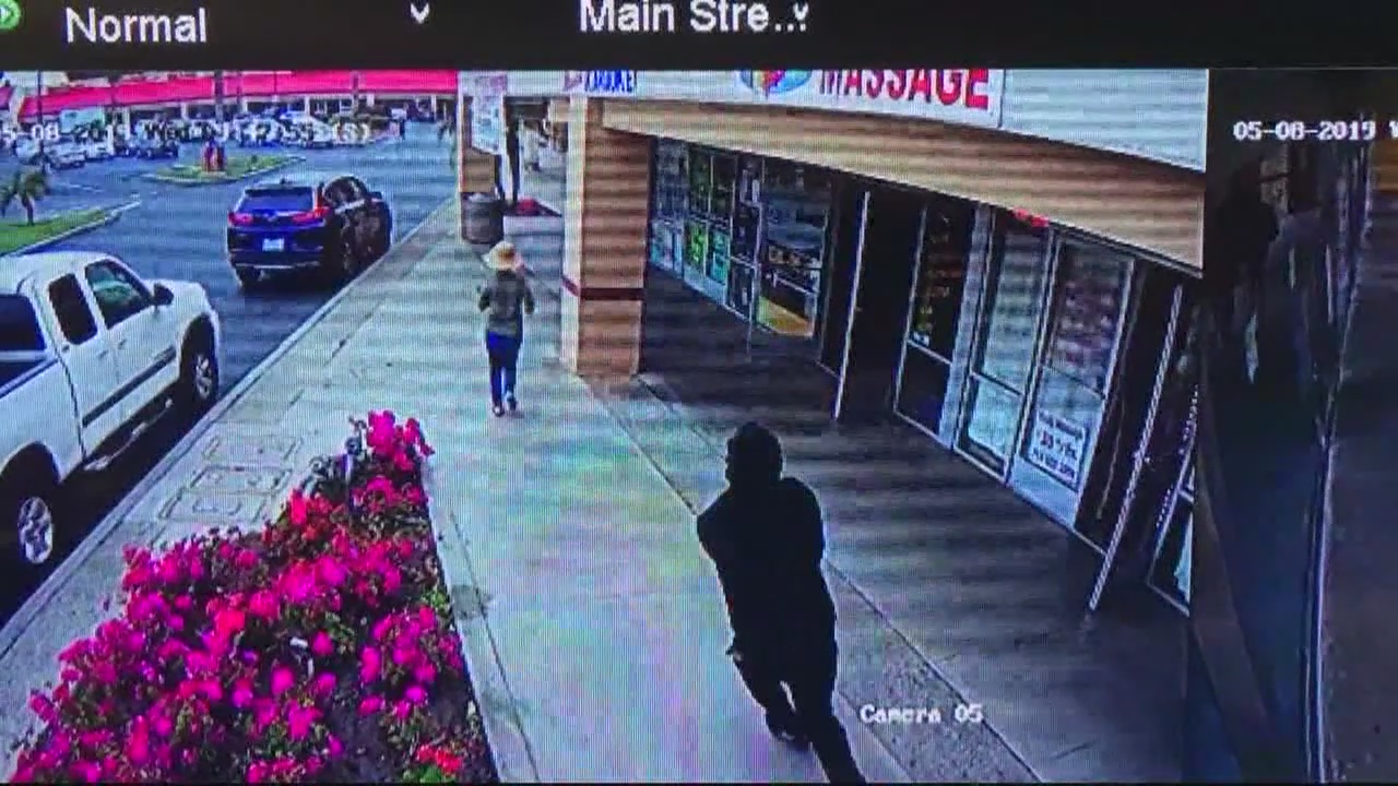 Woman run over by getaway car after robbery dies