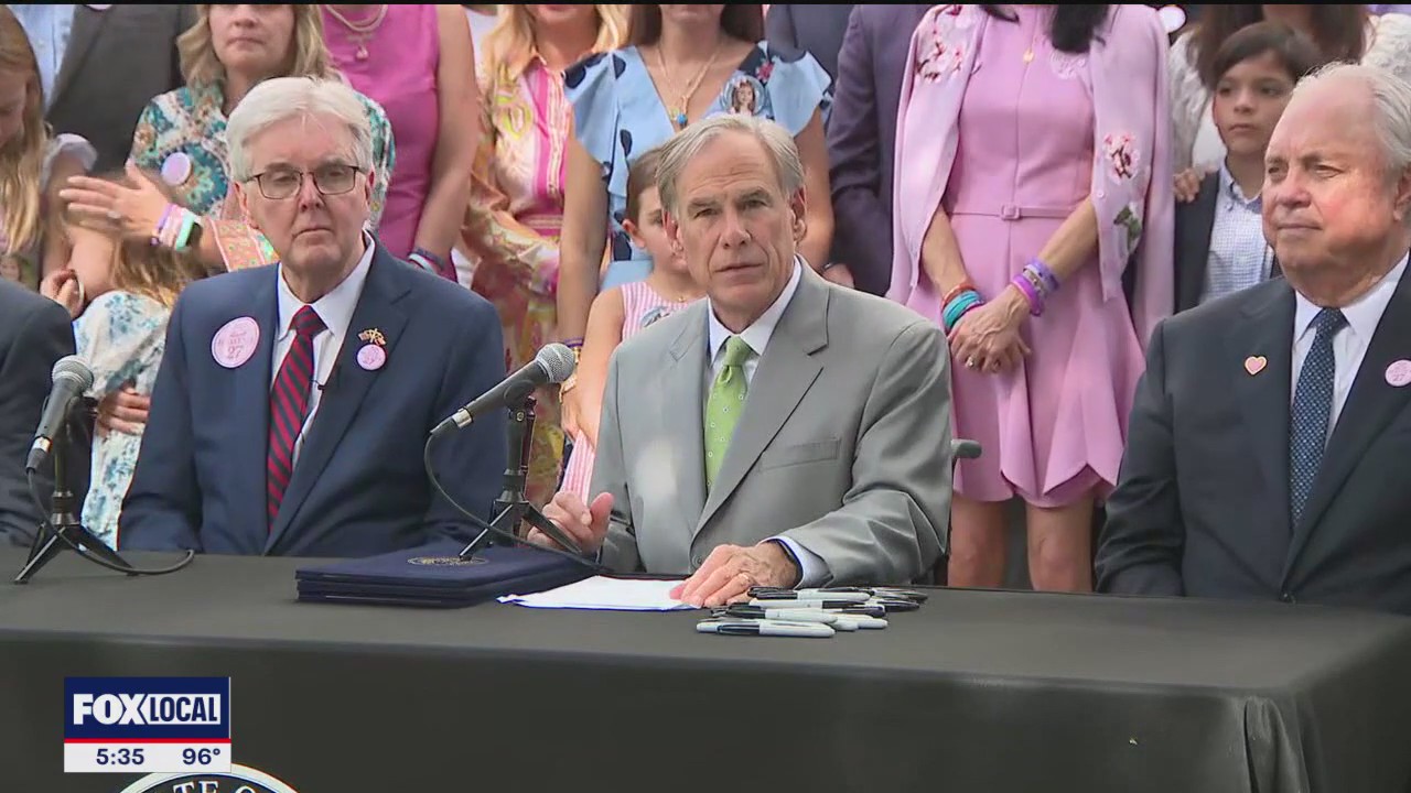 Abbott signs flooding bills with Camp Mystic families