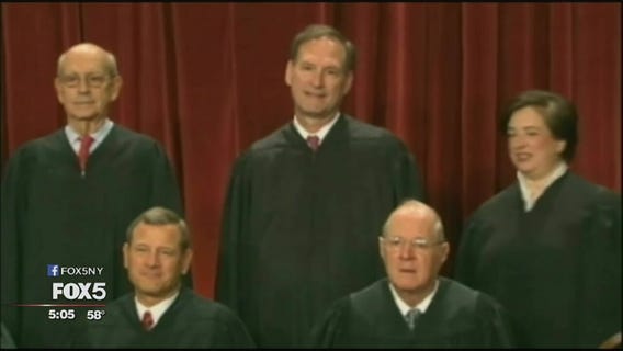 Justices weigh travel ban