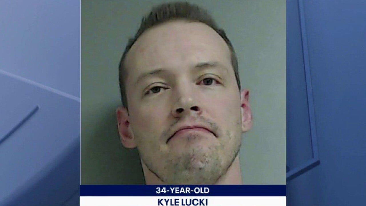 Accused of firing gun into neighbor's apartment