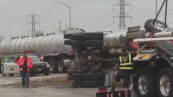 Overturned semi spills dirt, rocks across 605 Freeway