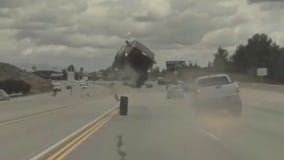 Car goes airborne, flips on Los Angeles freeway after hitting tire