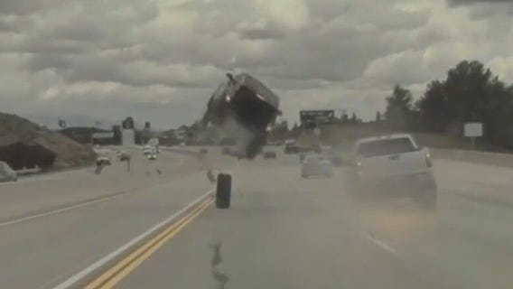 Car goes airborne, flips on Los Angeles freeway after hitting tire