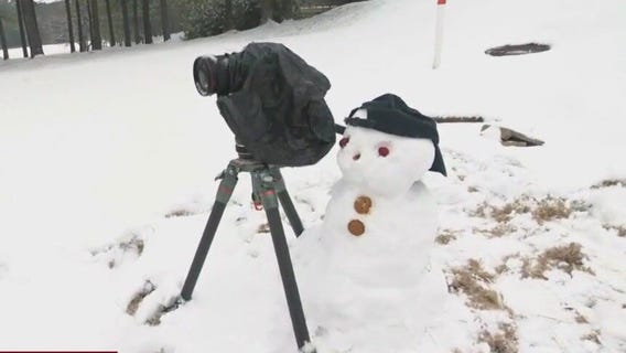 FOX 5 snow "camera" man