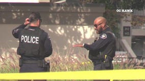 Man with crowbar shot after police standoff