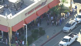 Long lines outside Honey Baked Ham before holidays