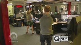 Q Intern participates in Hug a Newsperson Day