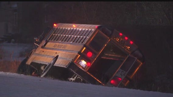 Michigan school bus carrying kids slides into ditch