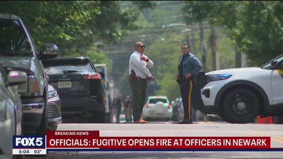 NJ fugitive fires shots at officers in standoff involving baby