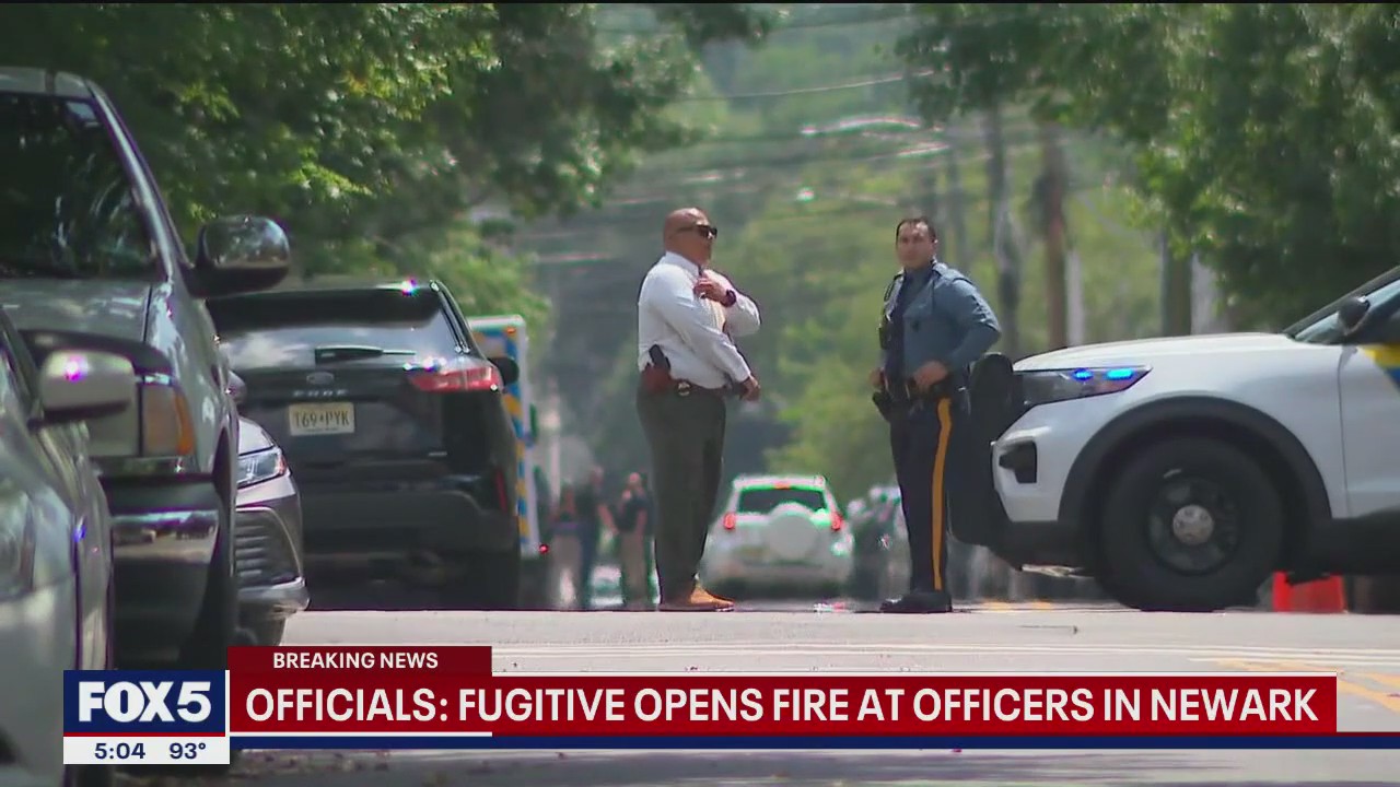 NJ fugitive fires shots at officers in standoff involving baby