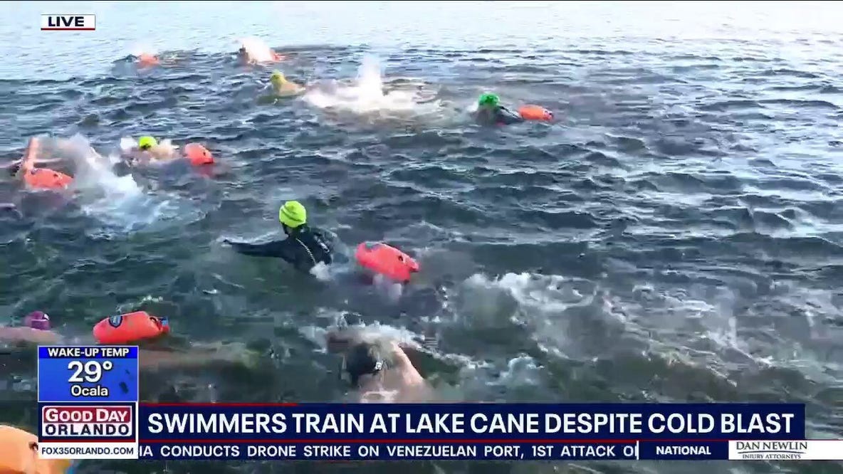 Swimmers brave cold at Lake Cane