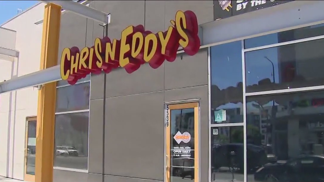 Woman hands couple a baby in Hollywood