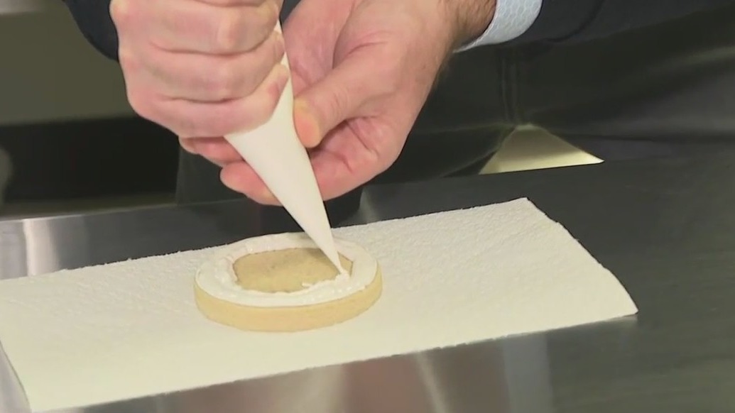 Frosting cookies at Yaya's Sweet Treats