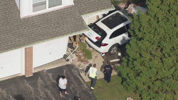 Car crashes into Cook County home, driver taken to hospital