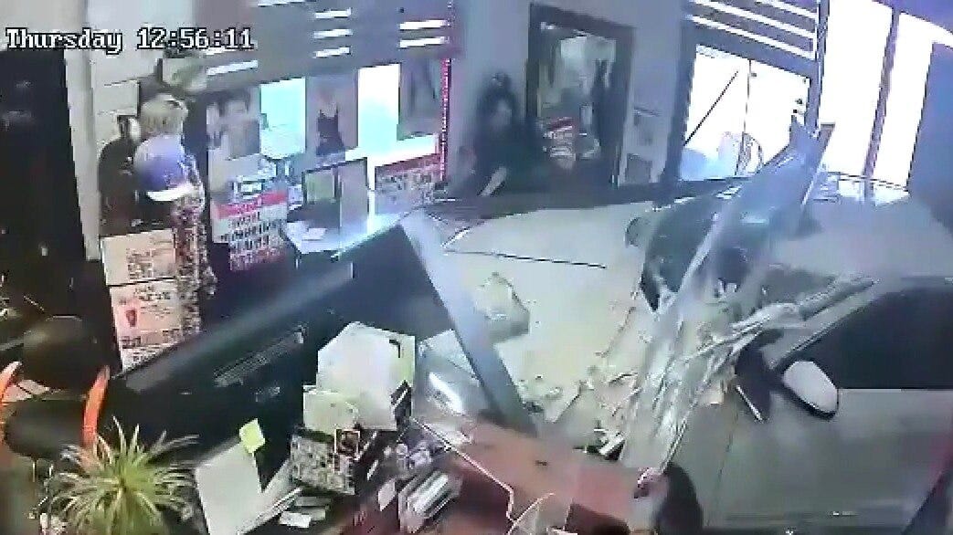 Car smashes into 2 OC businesses