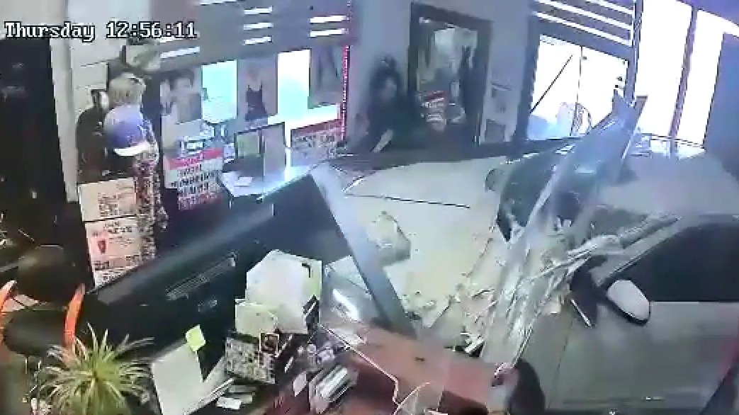 Car smashes into 2 OC businesses