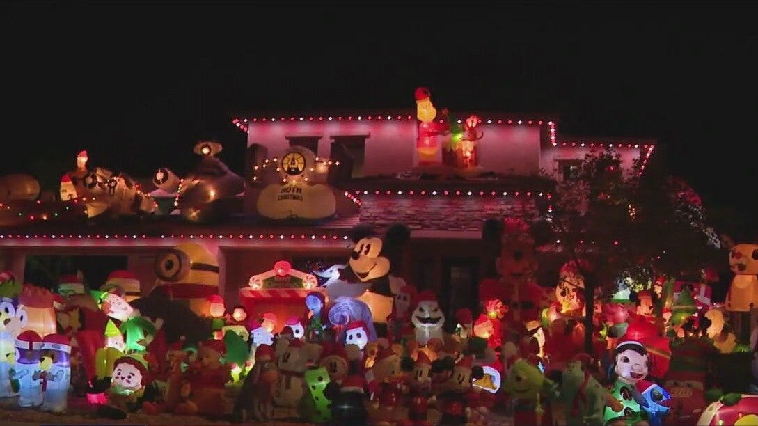 AZ home's yard filled with holiday inflatables
