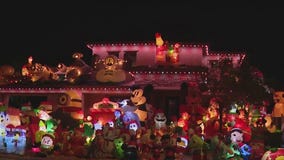 AZ home's yard filled with holiday inflatables