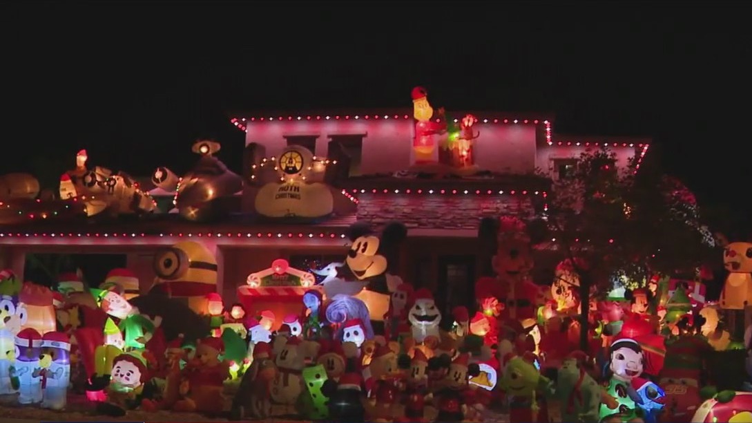 AZ home's yard filled with holiday inflatables
