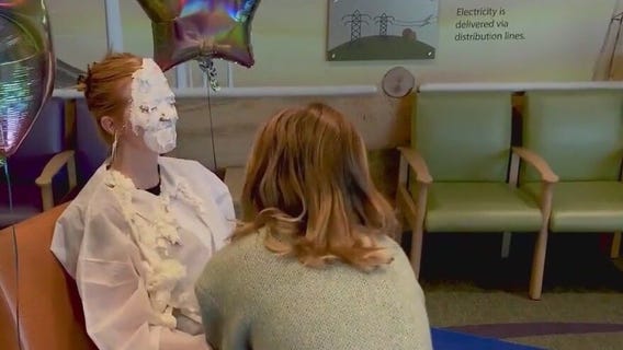 Cancer survivor celebrates by giving nurse pie in face