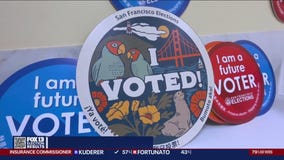 Who designs the 'I Voted' stickers?