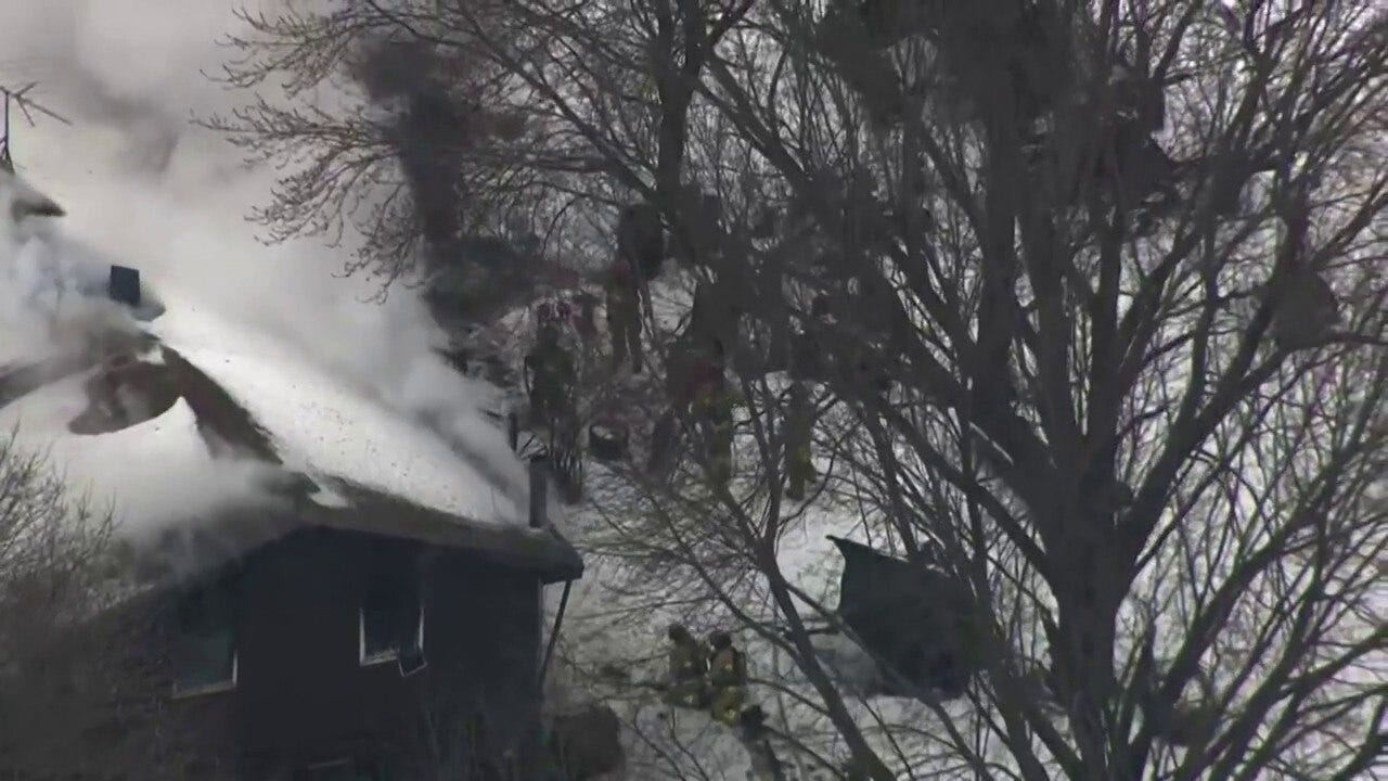 Chopper footage shows a Nowthen standoff at a home that caught fire