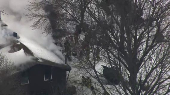 Chopper footage shows a Nowthen standoff at a home that caught fire