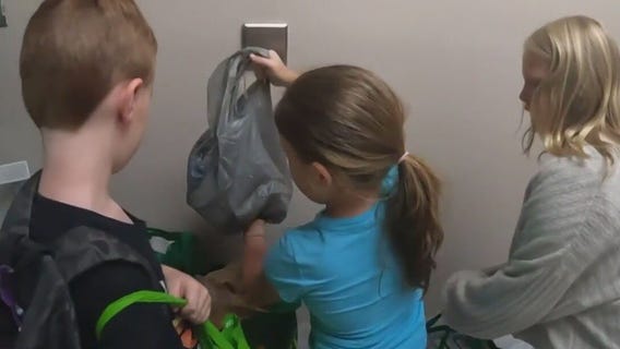 Children collect canned goods for Feast Food Pantry