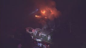 Firefighters battling a house fire in Sun Valley