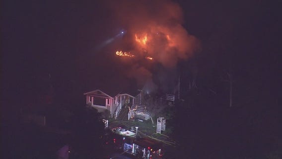 Firefighters battling a house fire in Sun Valley
