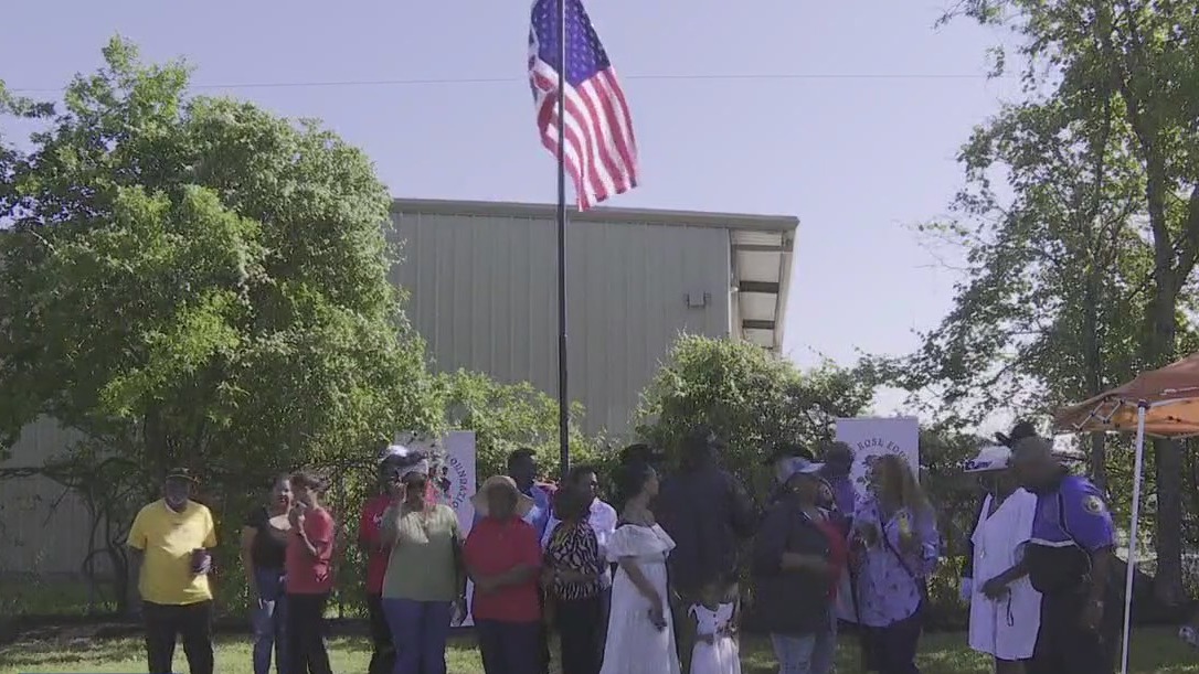 Flag raising ceremony at historic cemetery