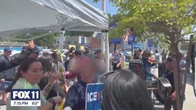 Live music, chats outside hotel housing ICE agents