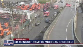 1 dead after car flies off SR 99 overpass onto street below in Seattle