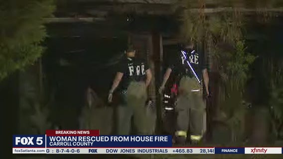 Woman rescued from house fire
