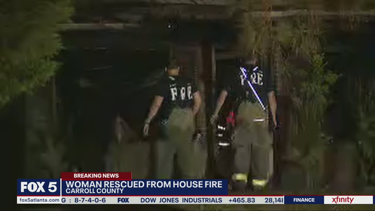 Woman rescued from house fire